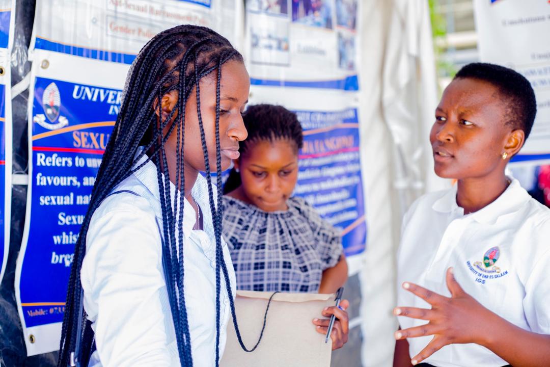 A speaker presenting a gender awareness orientation seminar to first-year students at the University of Dar es Salaam.
